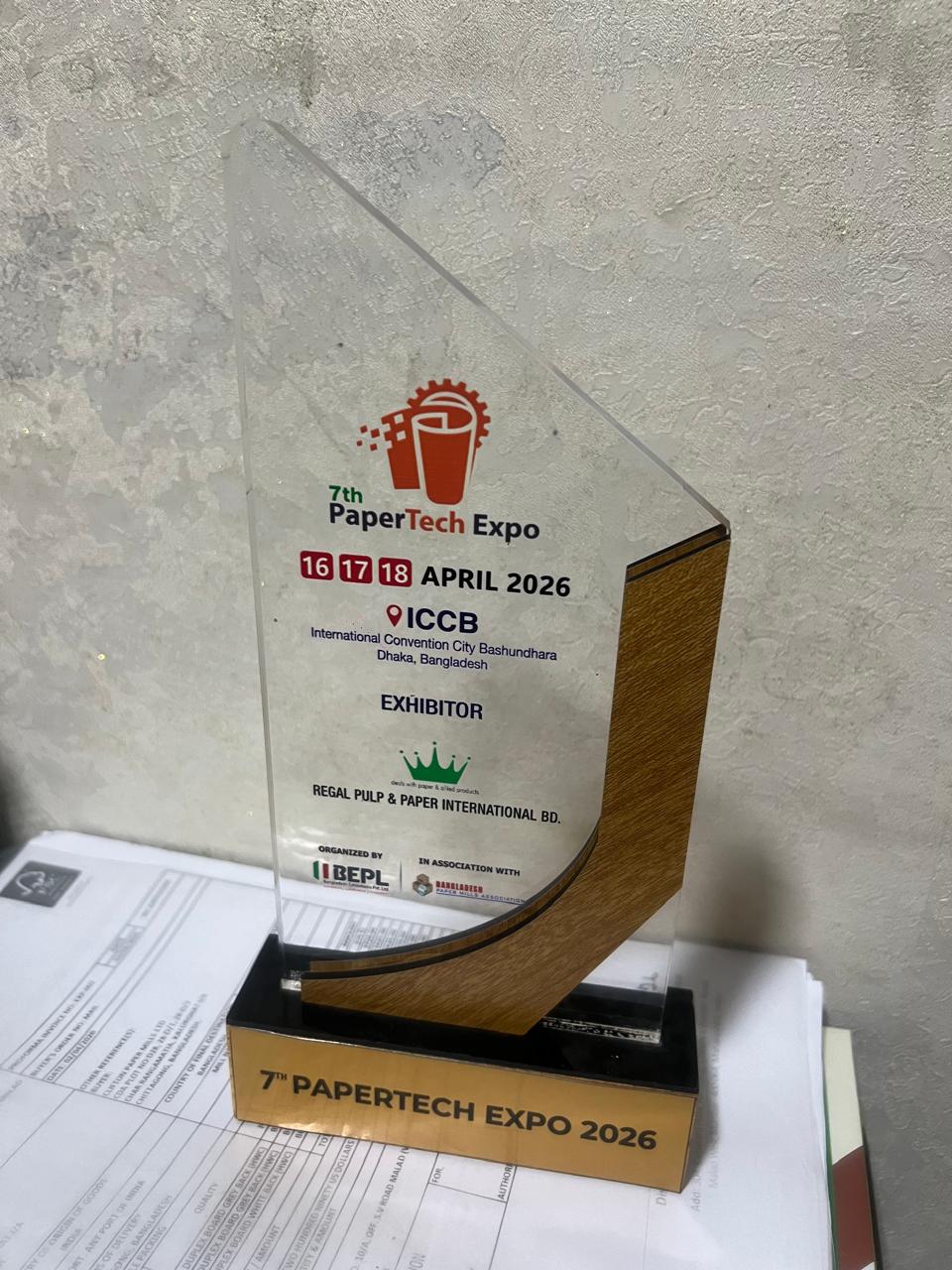 Papertech Expo 2026 photo showing exhibitor recognition and event award moment for Regal Pulp & Paper International BD